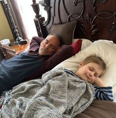 Doctor Dan Smithson taking a nap with his grandson Picture