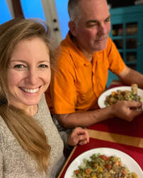 Coach Elizabeth and Doctor Dan Smithson eating whole food plant based pasta dish Picture